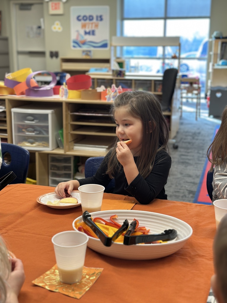student eating an apple slice