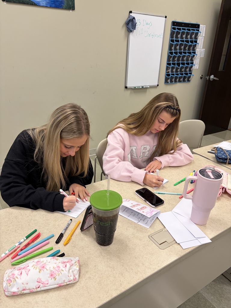 two high school students making cards