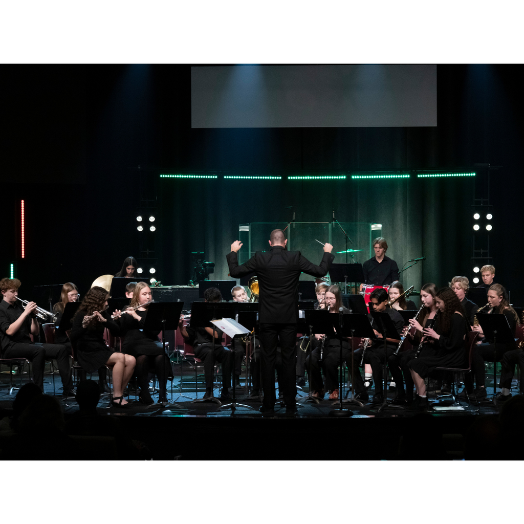 high school band students performing on stage during Christmas concert
