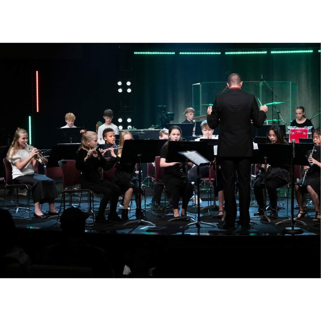 5th grade band students performing on stage during a Christmas concert