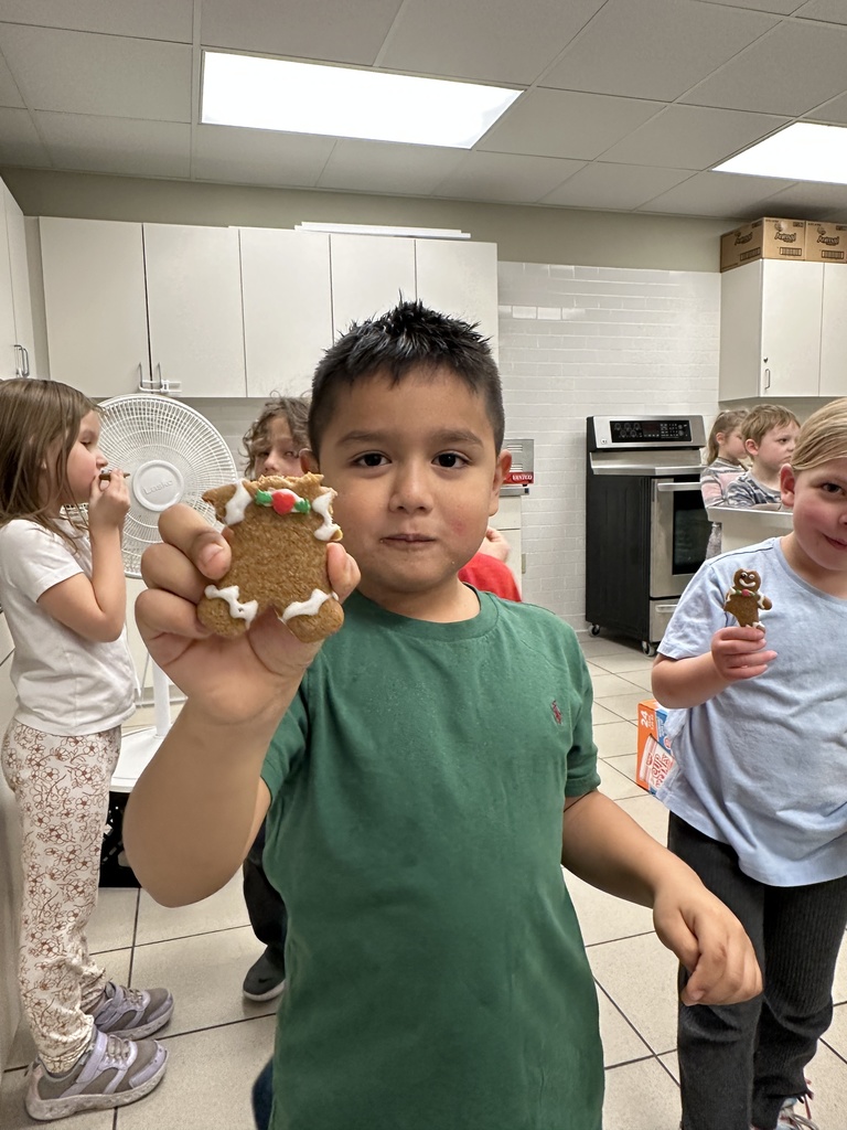 student showing his half-eaten cookie