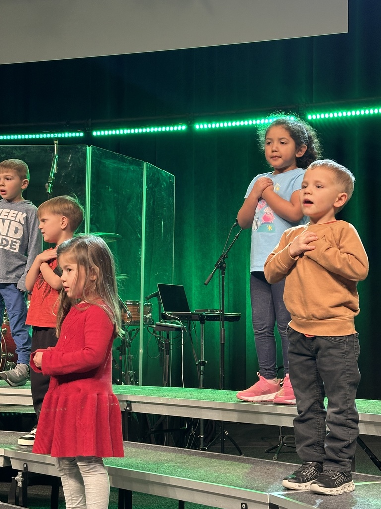 students singing on stage