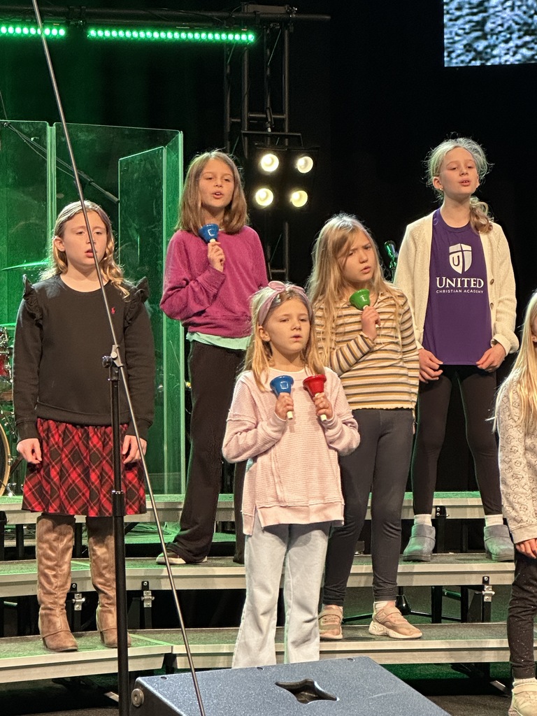 students singing on stage