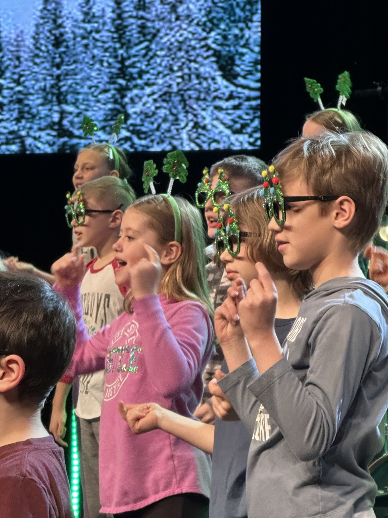 students singing on stage