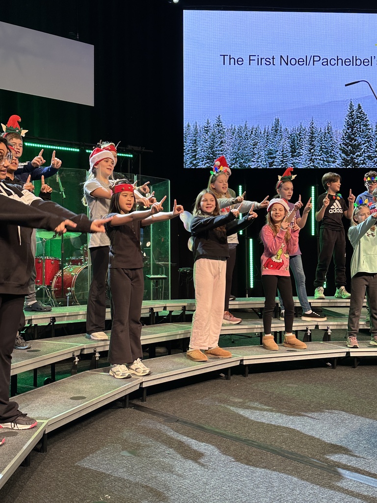 students singing and dancing on stage