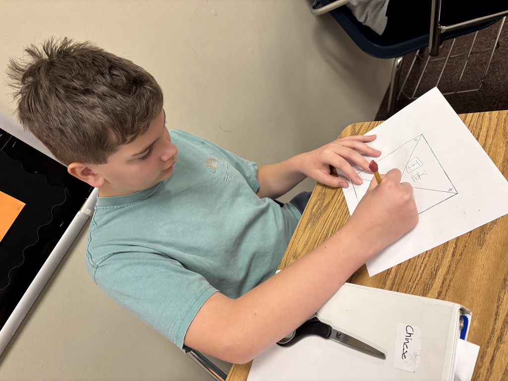 a student creating windmills in Chinese class