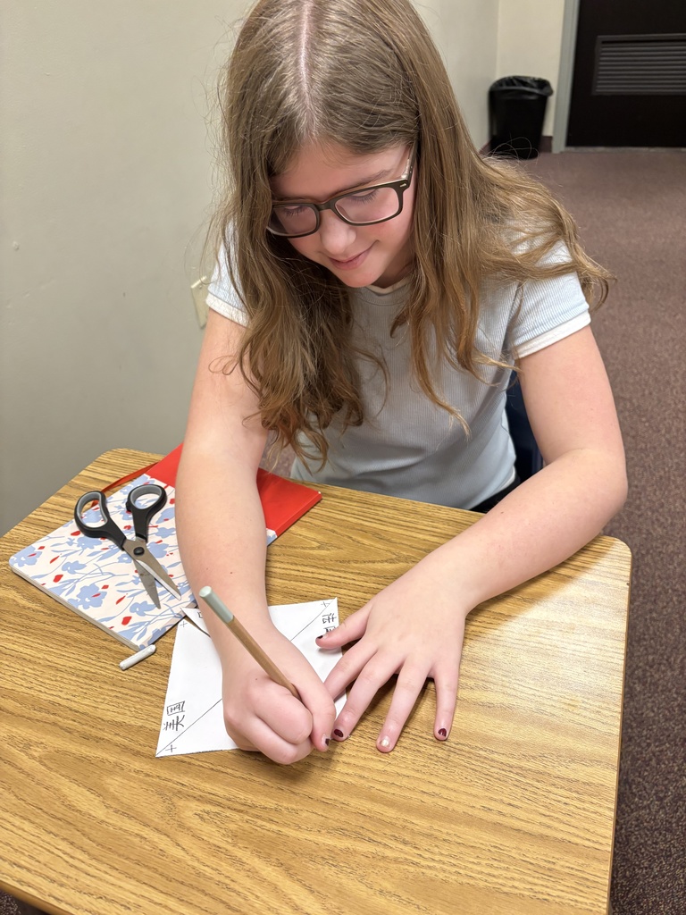 a student creating windmills in Chinese class