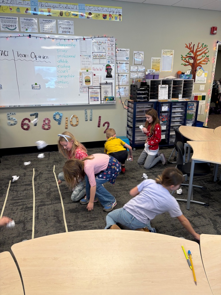 students throwing paper snowballs at each other