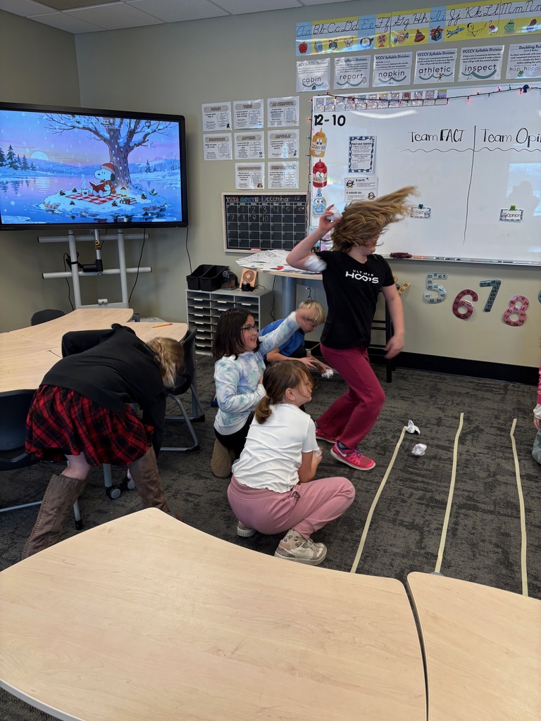 students throwing paper snowballs at each other