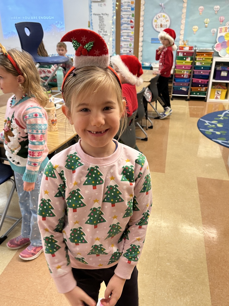 kindergarten student wearing a christmas headband