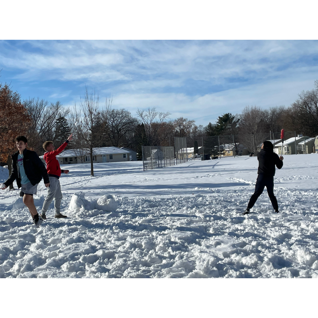 high school students playing baseball with snowballs