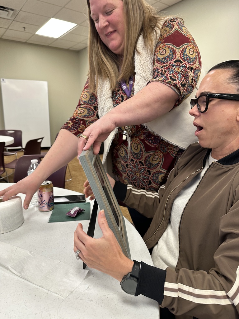 staff members playing a dice game to exchange white elephant gifts