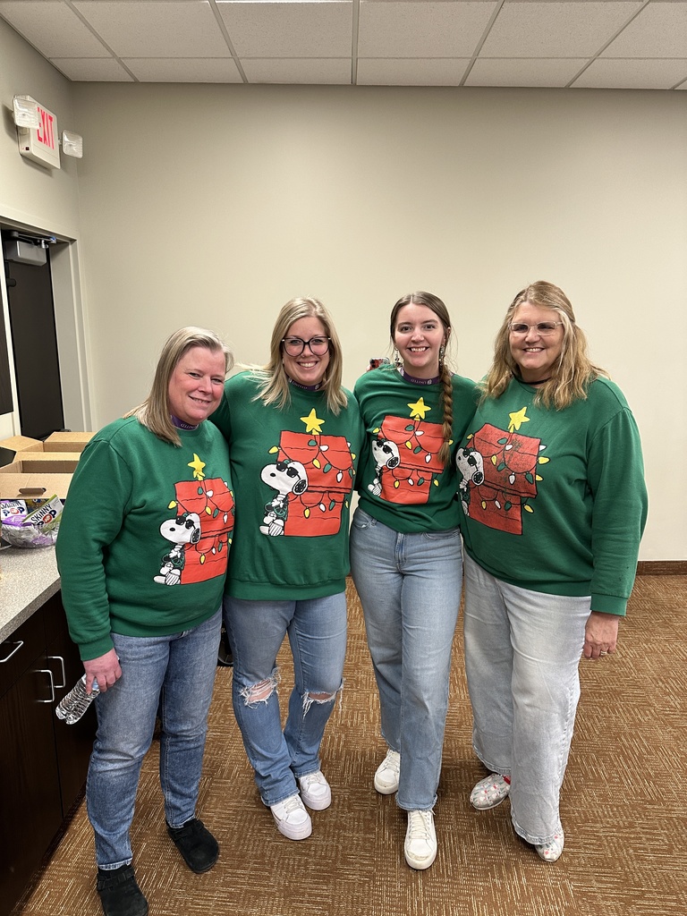 four staff members wearing the exact same shirt