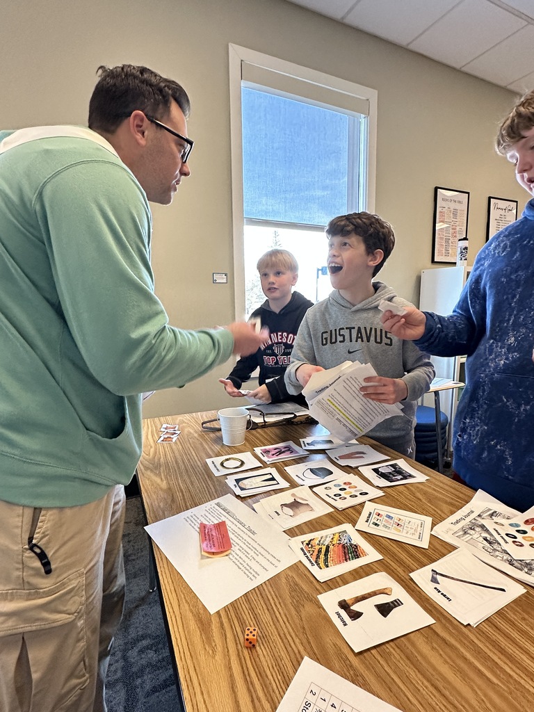 students trading beaver pelts in a fur trading simulation