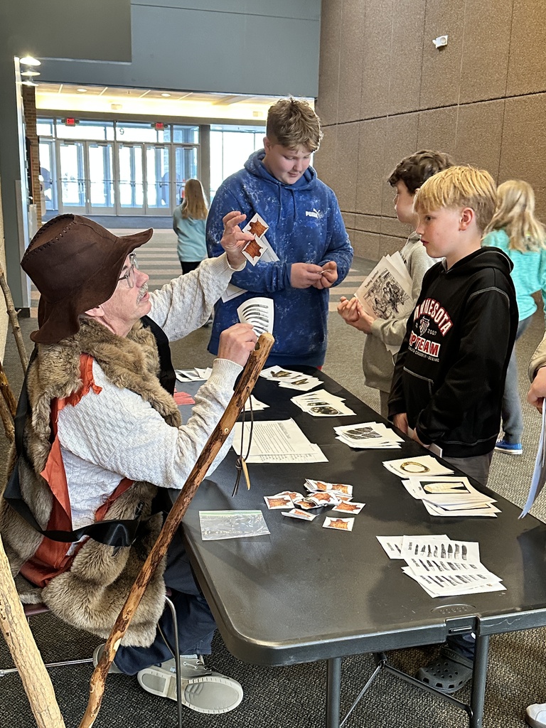 students trading beaver pelts in a fur trading simulation