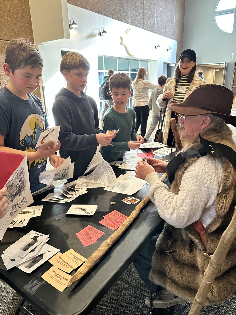 students trading beaver pelts in a fur trading simulation