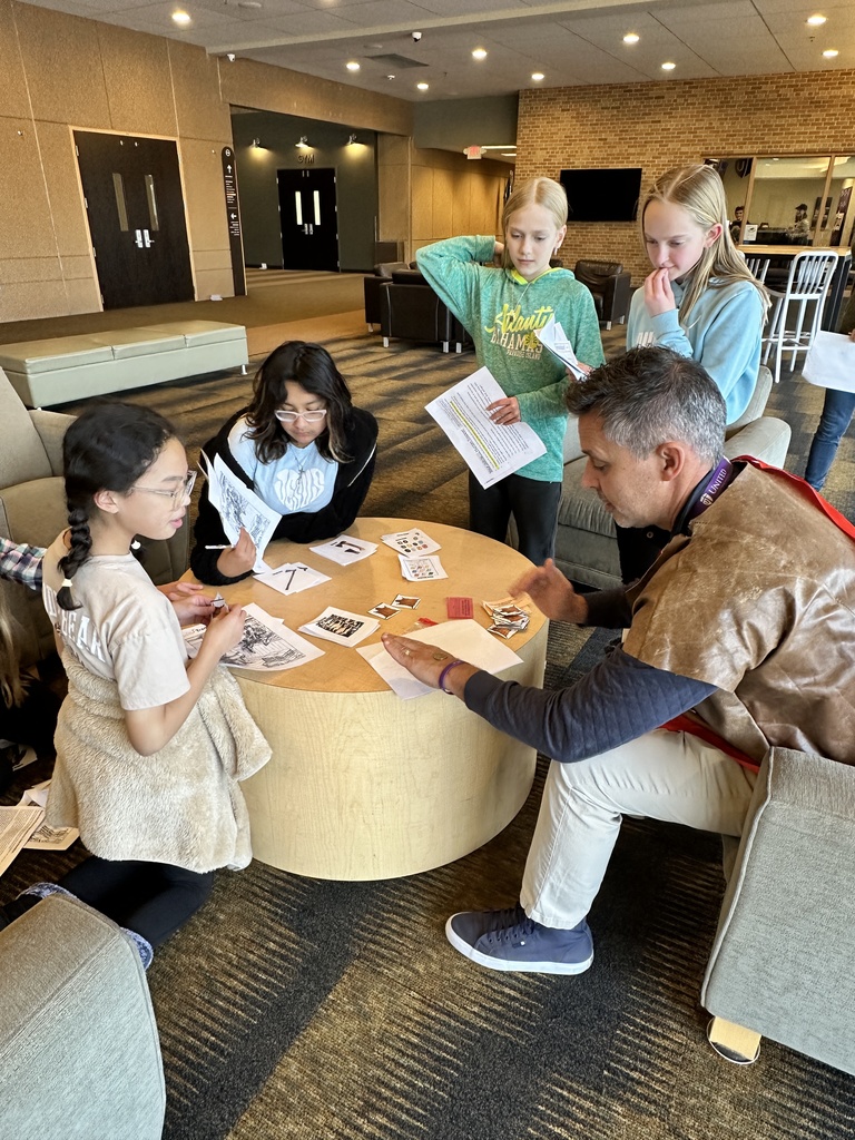 students trading beaver pelts in a fur trading simulation