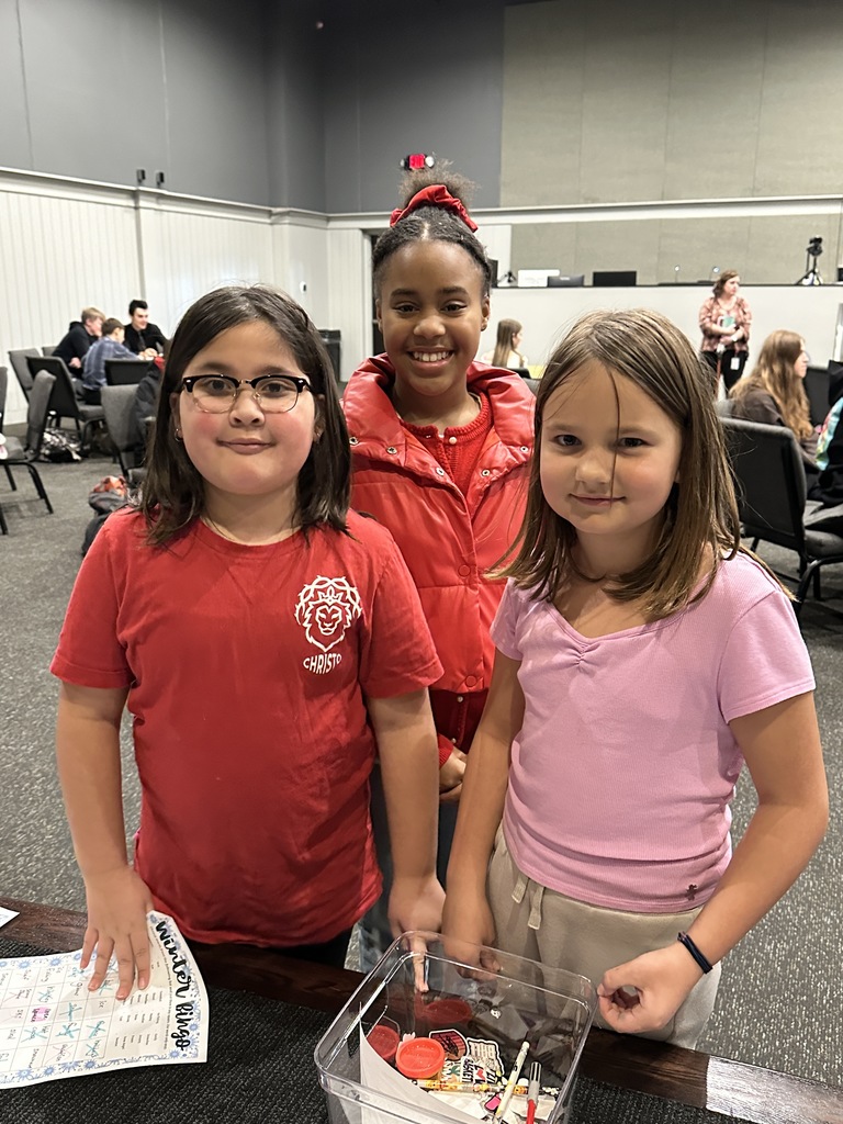 three students, one big buddy and two little buddies, smiling for the picture