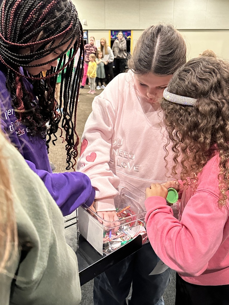 students picking prizes out of a bin
