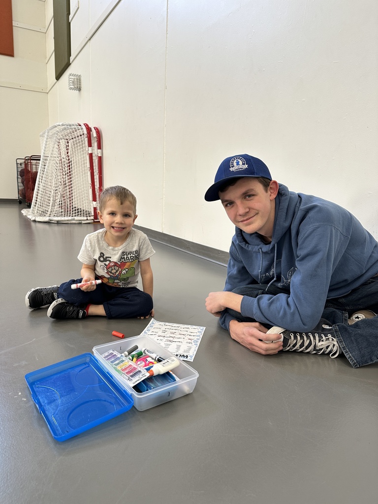 two students, one big buddy and one little buddy, smiling for the picture