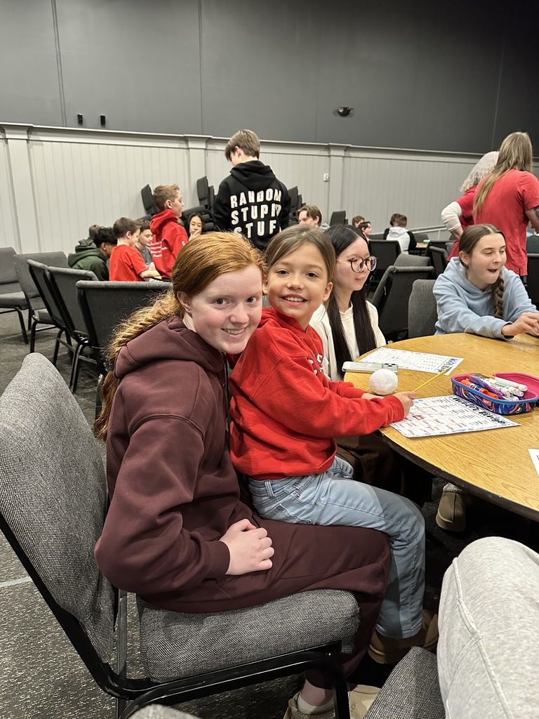 two students, one big buddy and one little buddy, smiling for the picture
