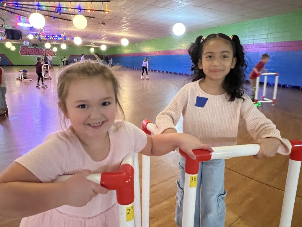 two second grade girls roller skating