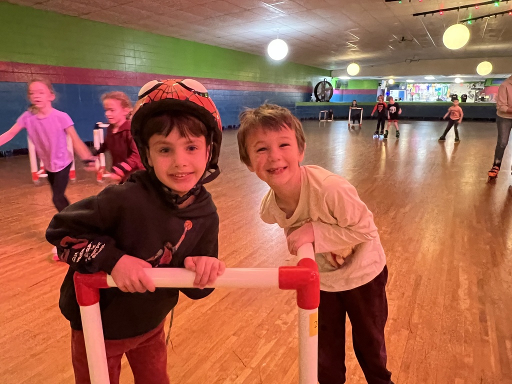 two kindergarten boys roller skating