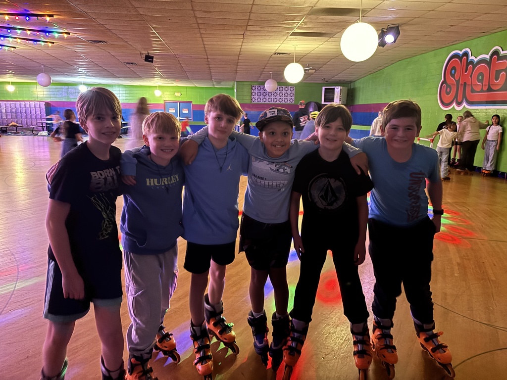 group of fifth grade boys at a roller skating rink