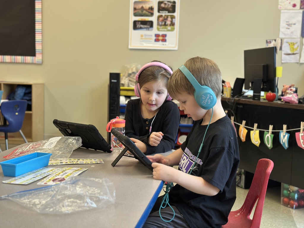 kindergarten students working on their iPads