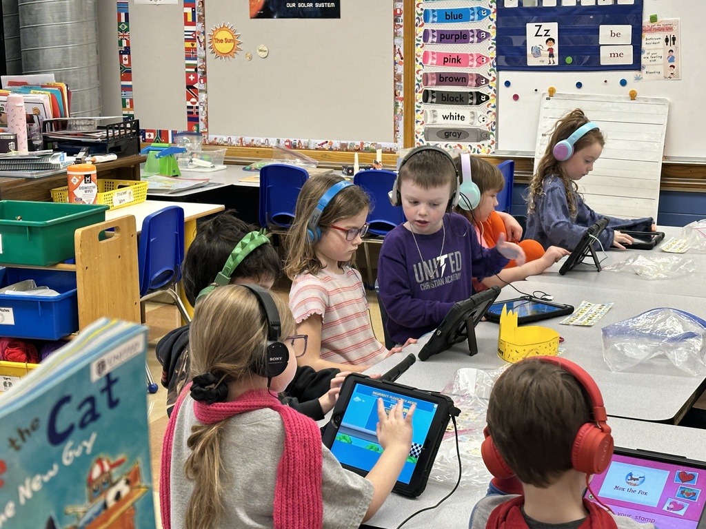 kindergarten students working on their iPads