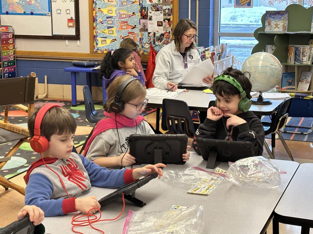 kindergarten students working on their iPads