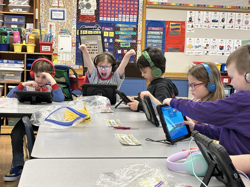 kindergarten students working on their iPads
