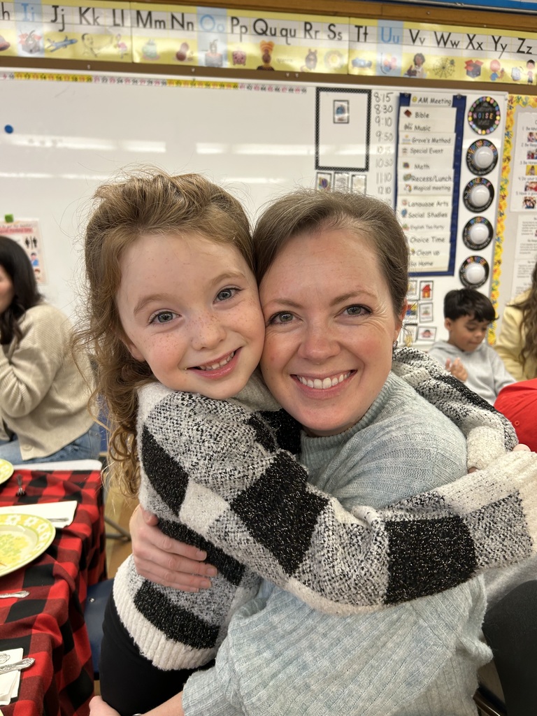 kindergarten student with their special guest at a tea party