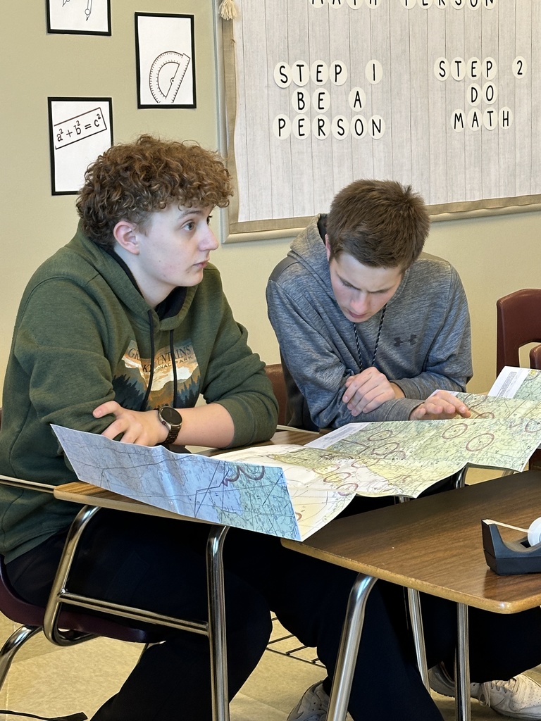 students studying aviation airspace maps