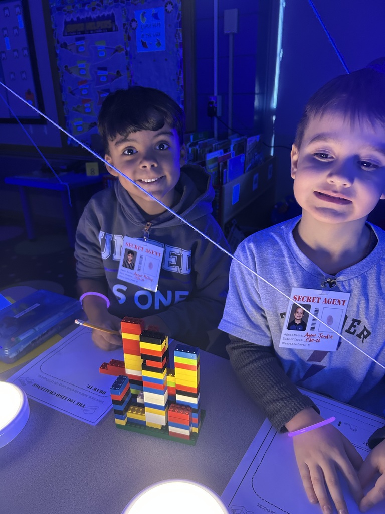 kindergarten boys playing a game with legos