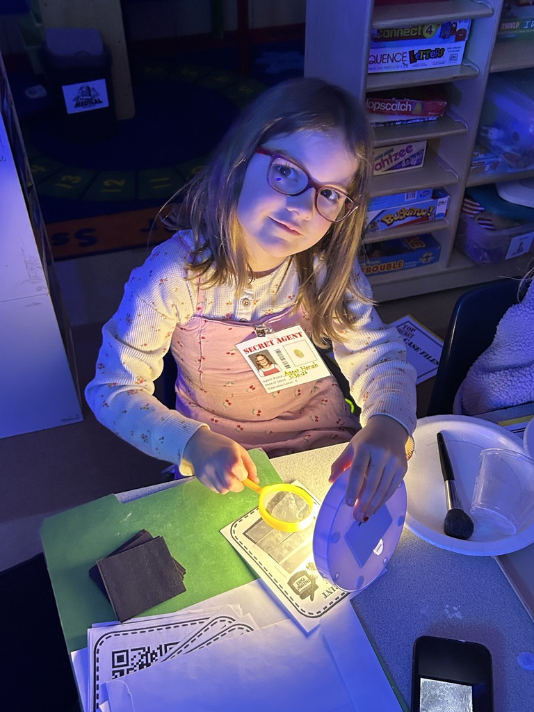 student playing a detective counting game