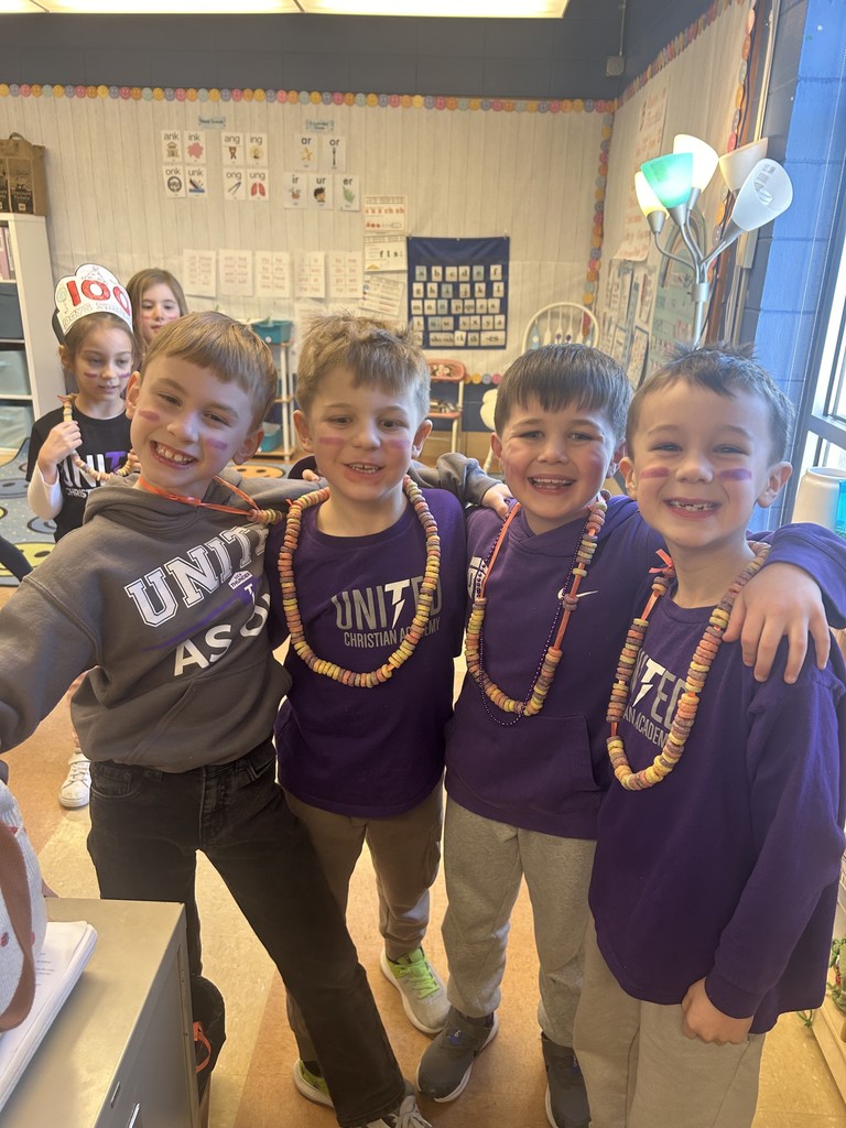 group of 1st grade boys wearing fruit loop necklaces