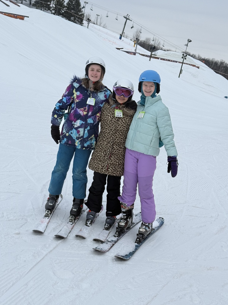 group of middle school students on a ski hill for a field trip