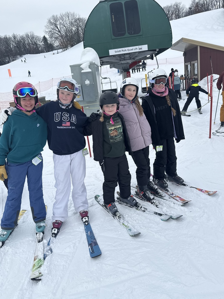 group of middle school students on a ski hill for a field trip