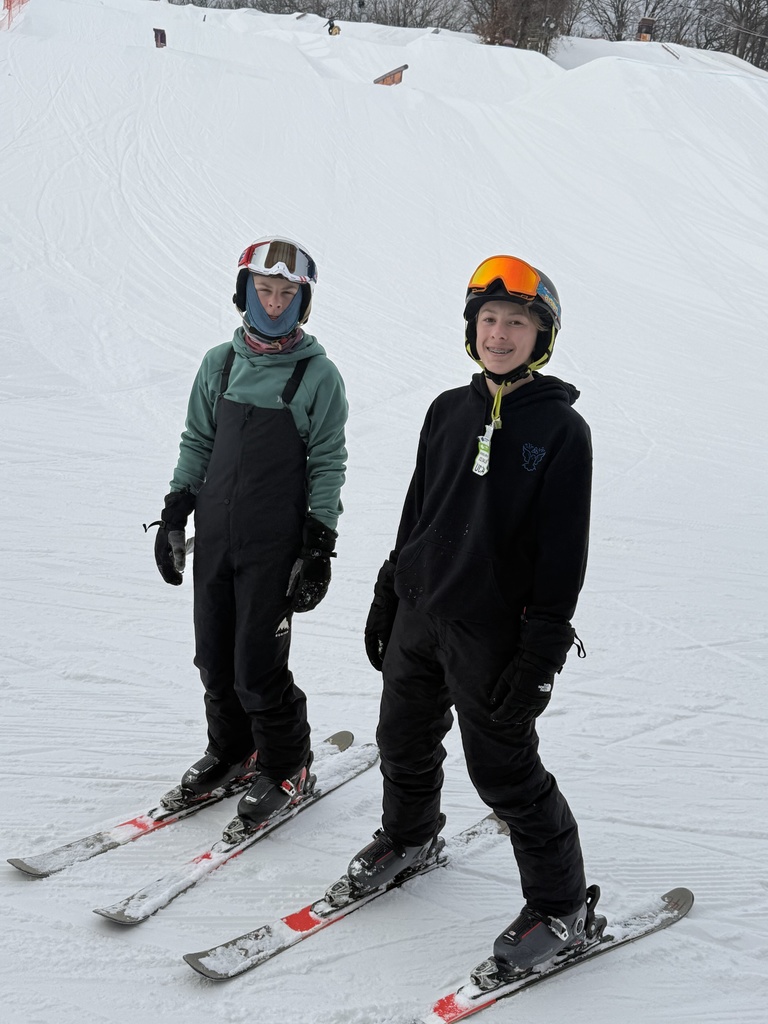 group of middle school students on a ski hill for a field trip