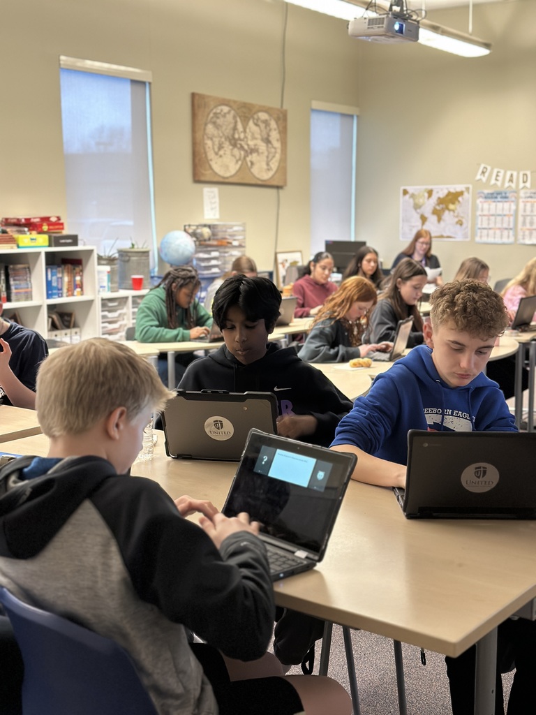 students sitting in a classroom working on their Chromebooks