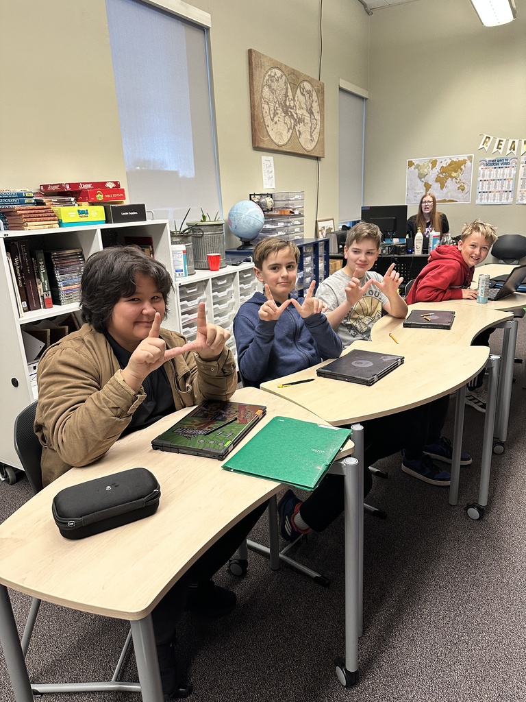 students sitting in a classroom working on their Chromebooks