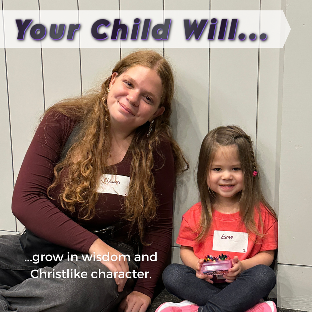 a senior and a pre-k student sitting on the floor together
