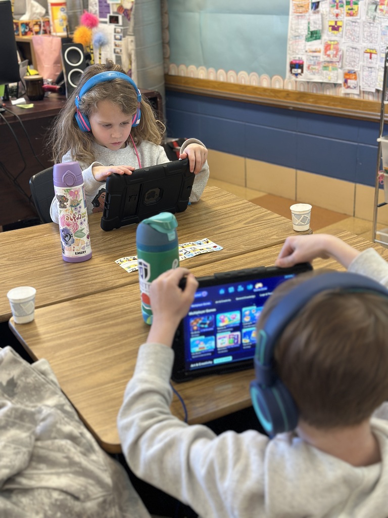 1st grade students working on their iPads