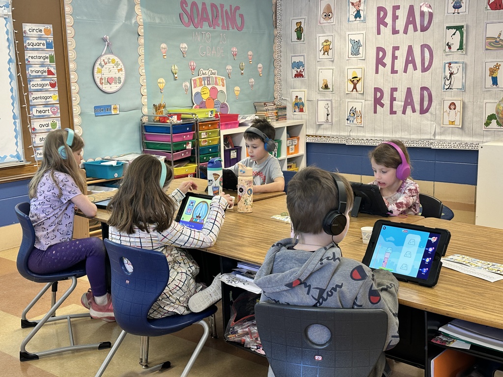 1st grade students working on their iPads