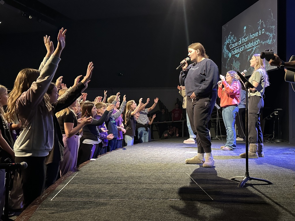 secondary students worshiping in chapel