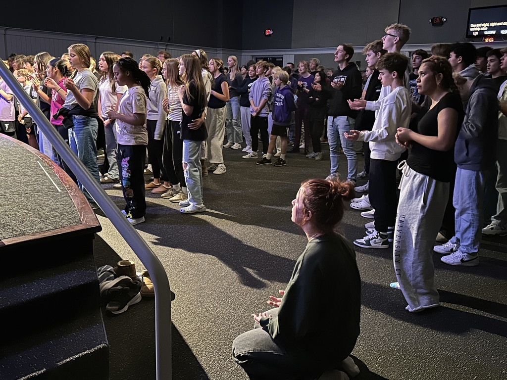 secondary students worshiping in chapel
