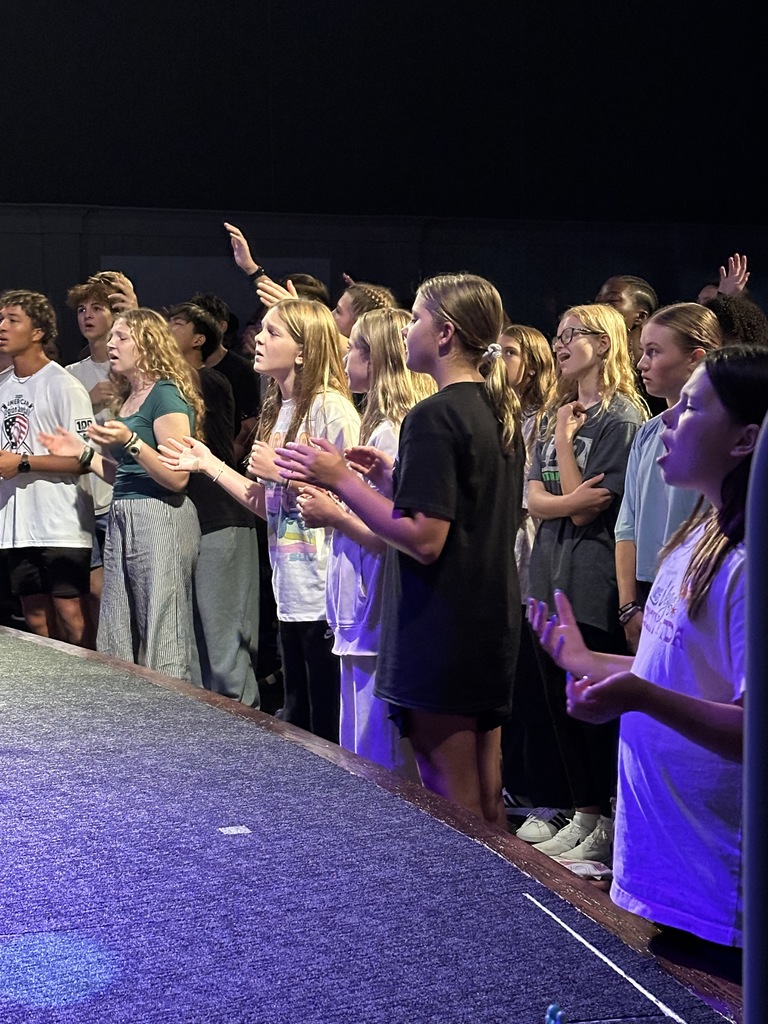secondary students worshiping in chapel
