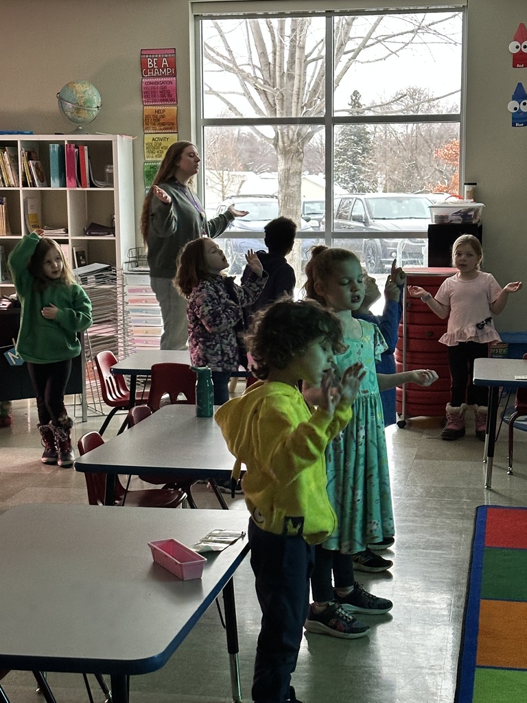 students worshiping in their classroom