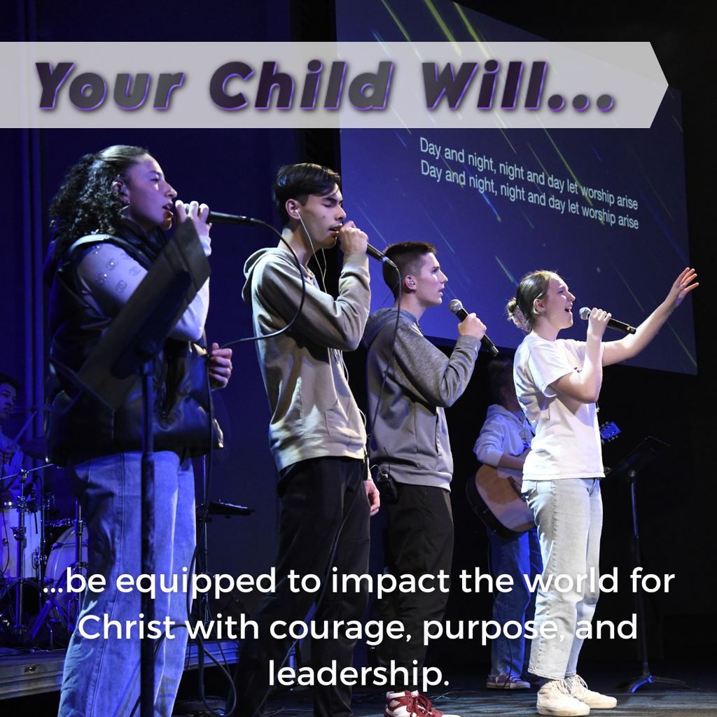 students singing worship songs in a chapel service